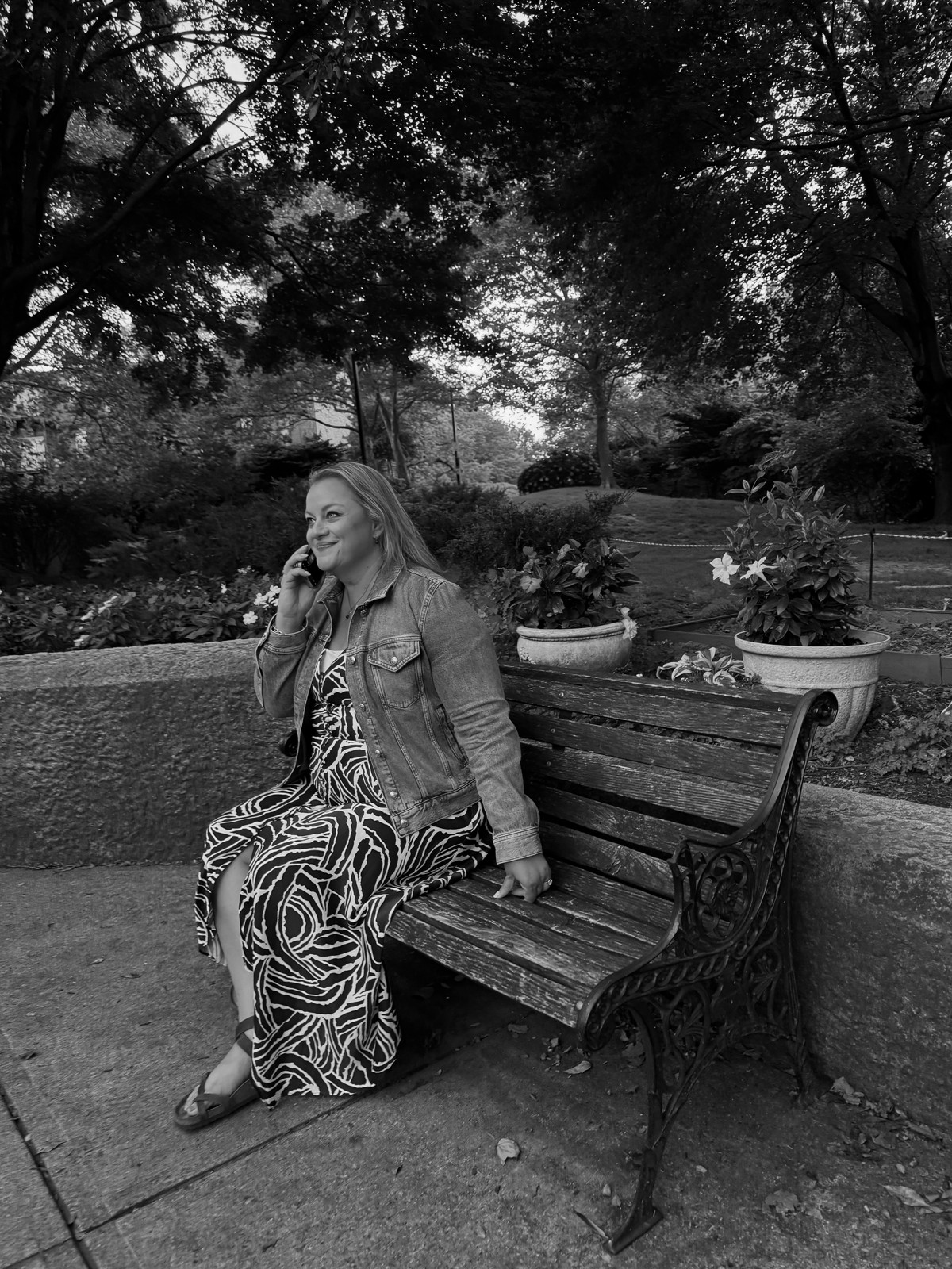 Kris Porter on a park bench, on a call with a client